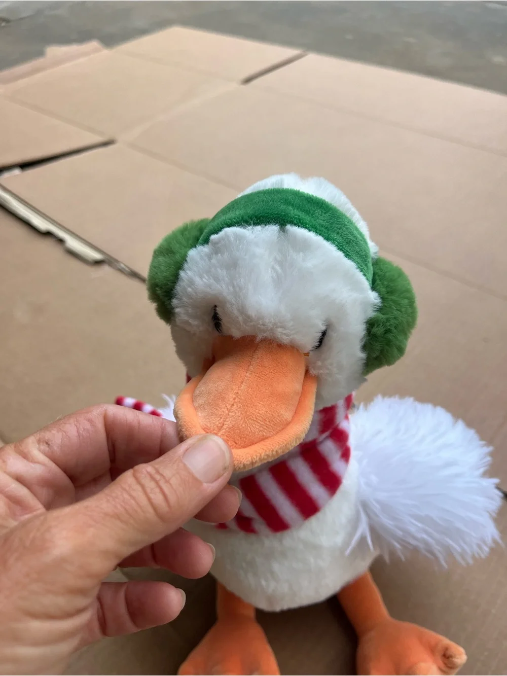 Plush Holiday Duck with Green Ear Muffs and Red Stripe Scarf